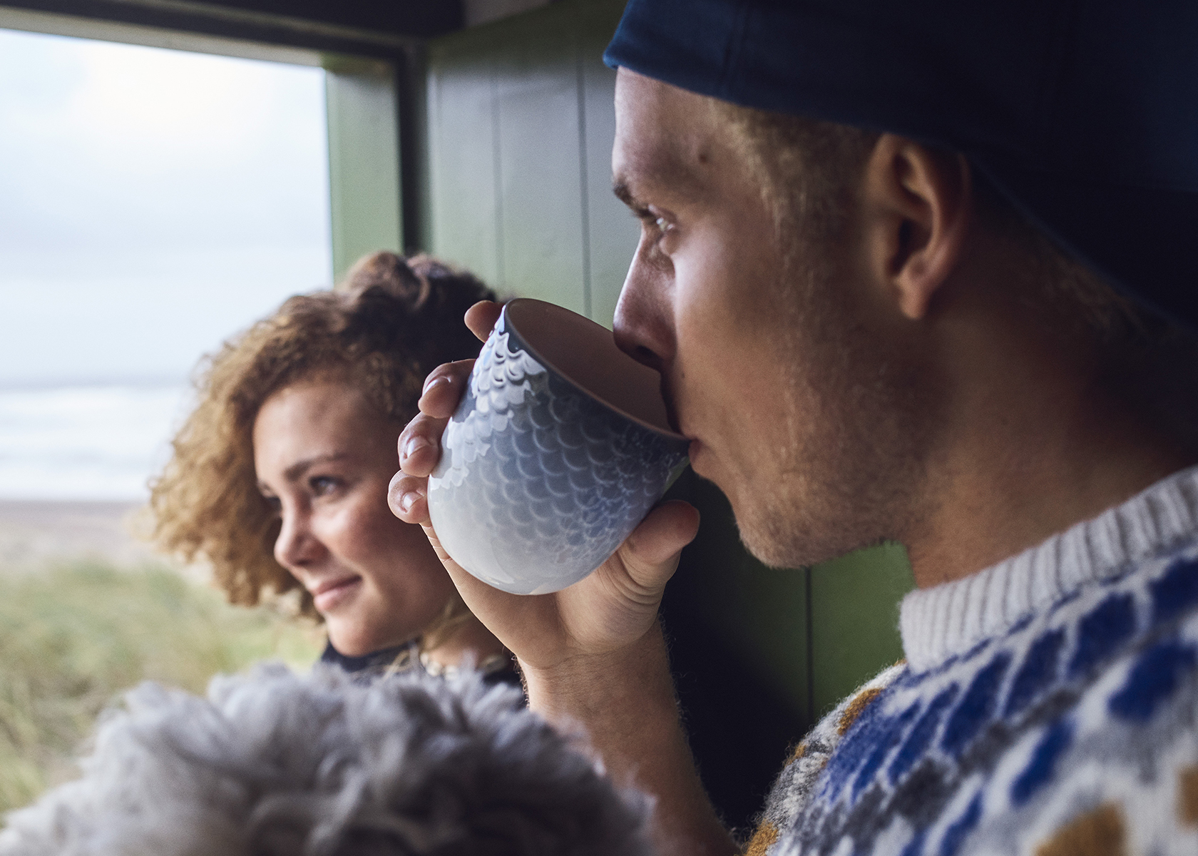 a man drinking  his morning coffee from the HAV Thermal Mug before spending his day outside with his loved one